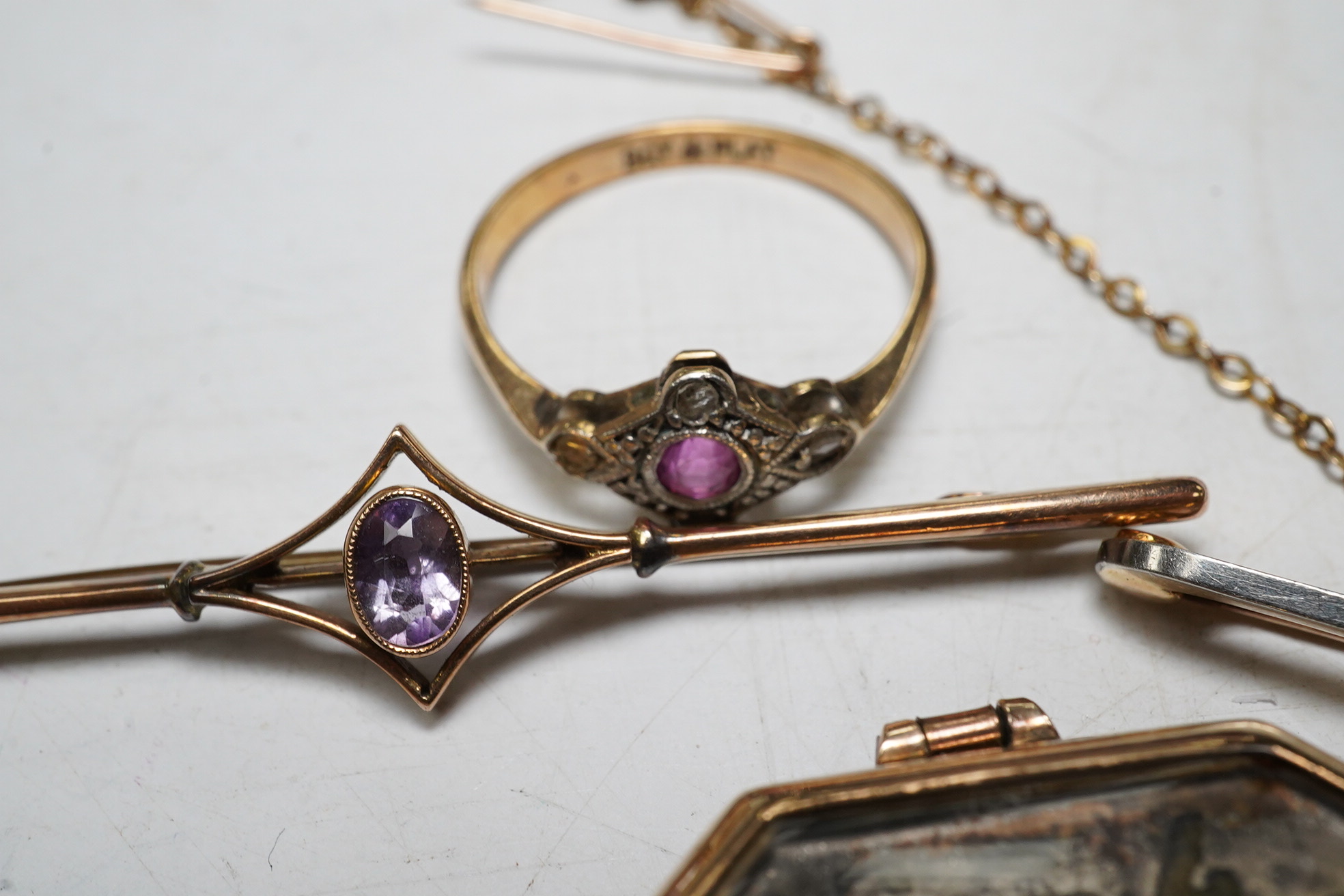 An enamelled 15ct gold Royal Engineer's sweethearts brooch with diamond chips, 5cm, gross 5.8 grams, a gold wrist watch, a 9ct gold and amethyst bar brooch, 2.1 grams, a ruby and diamond chip set 9ct gold dress ring, gro